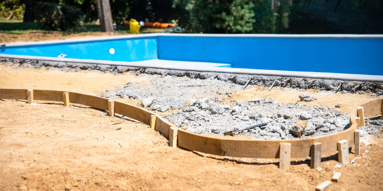 Digging and placing new swimming pool in backyard