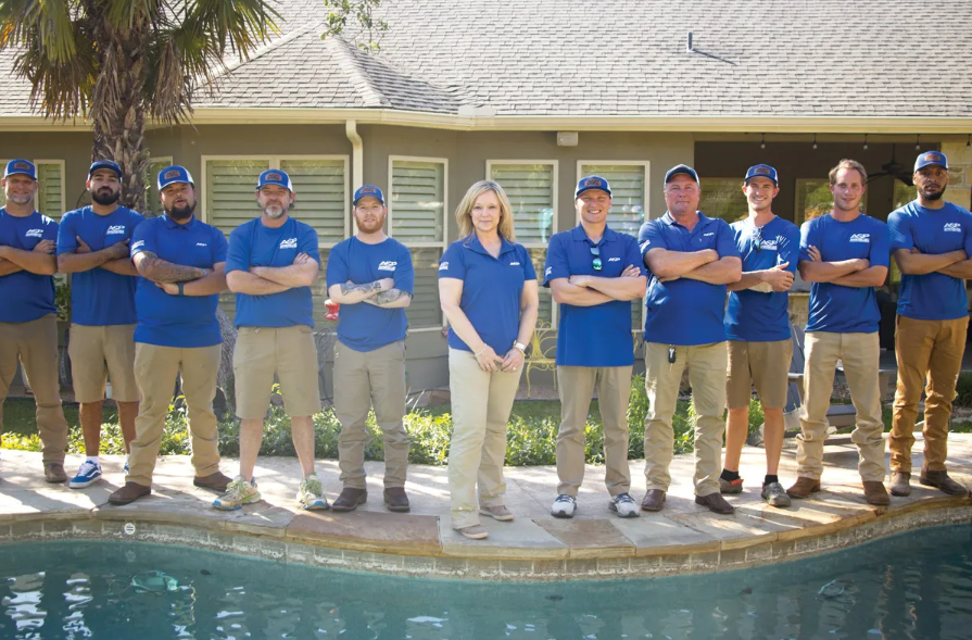 ASP Schertz team infront of a pool